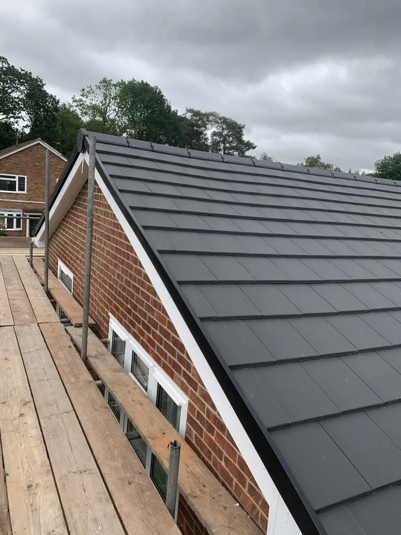 New dark grey tiled pitched roof