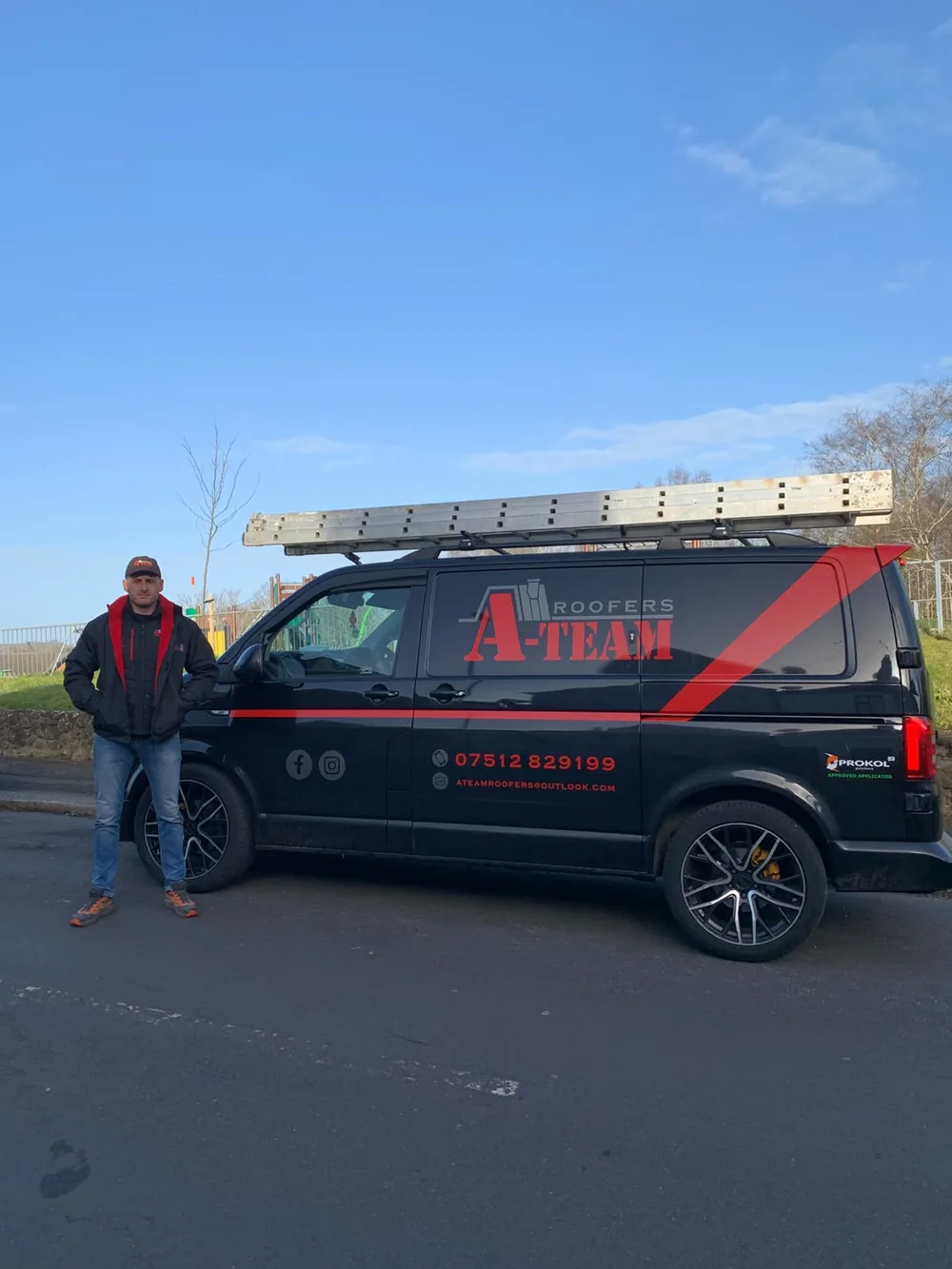 Darren, owner of A Team Roofers, beside the company van